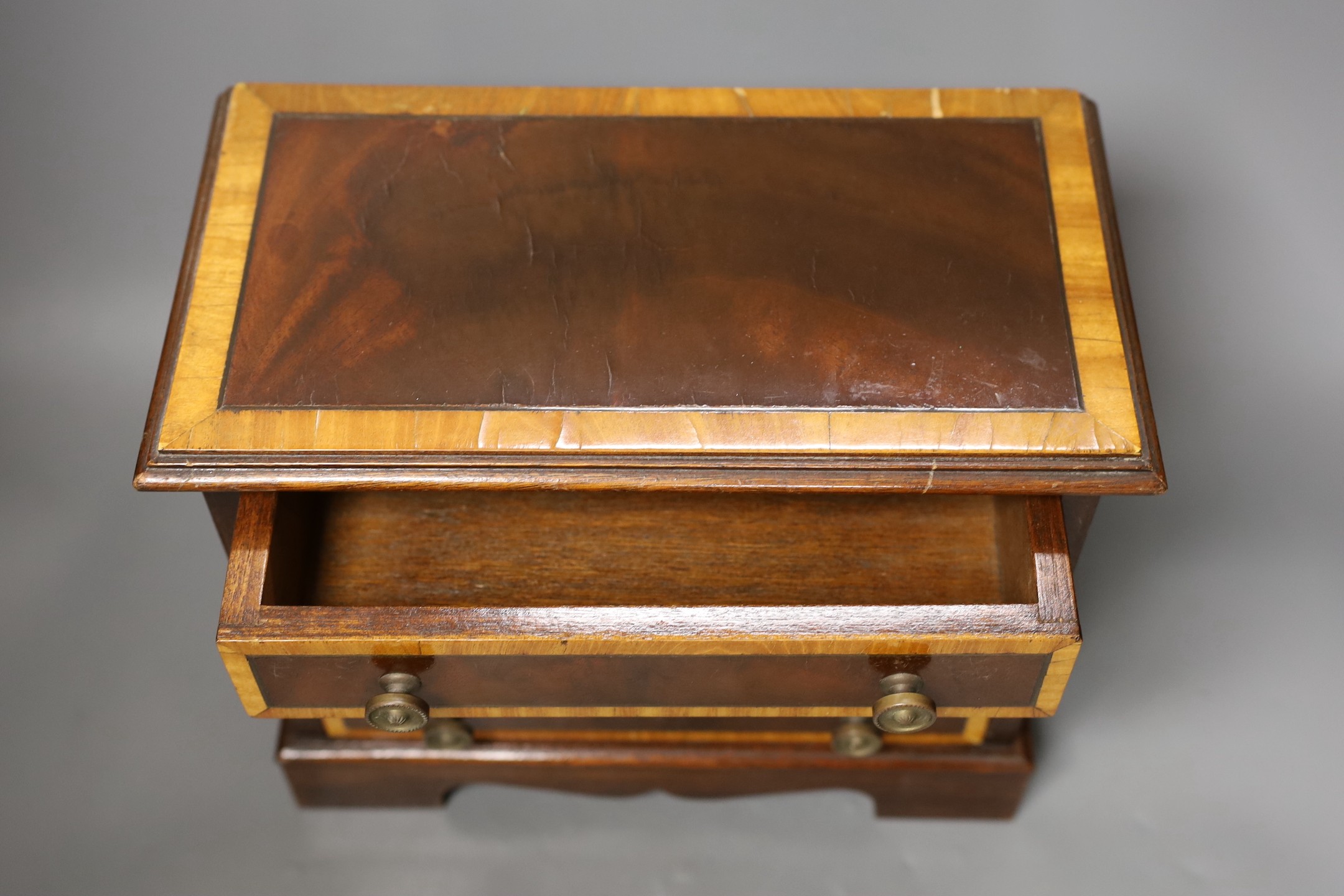 A miniature inlaid mahogany chest, 29cms wide x 25.5 cms high